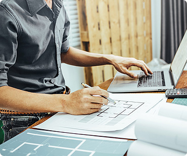 A person working on some papers at a desk